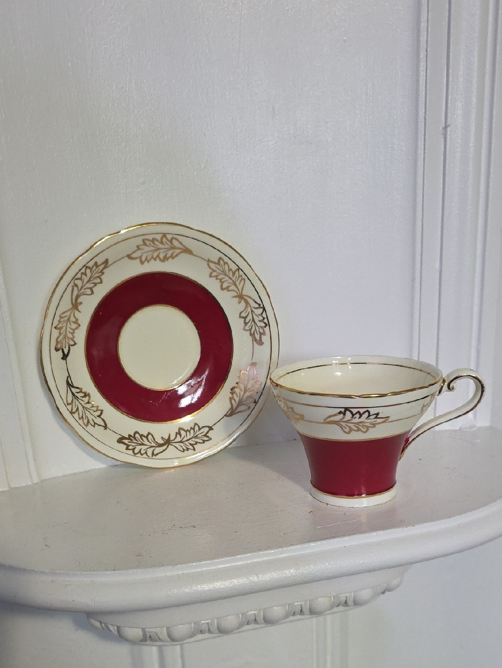 vintage Aynsley bone china teacup and saucer set in burgundy red and gold. 
